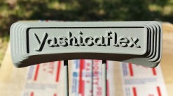 First coat of self etching primer on the bare aluminum nameplate. This coat will get wet sanded with 320 grit paper and then another coat of a final lighter weight primer. That final primer will get wet sanded with 1200 grit paper and then the final color coat will be applied.