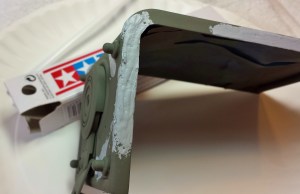 The back door had suffered severe metal corrosion and needed to have the corroded areas repaired. Some filler putty and some wet sanding and another coat of primer should do it.