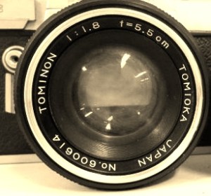 Amazing Tomioka lens for the Yashica Pentamatic series of SLR cameras. Yashica's lenses were always (as best as I can tell) made for them by world famous Tomioka Optical in their Tokyo factory. Sometimes you'll find a lens that carries both a "Yashica" name and a "Tomioka" name on the lens ring. This rather rare lens sports only the Tomioka names... Tominon and Tomioka! This lens of course has the unique Pentamatic bayonet mount and would not fit any other cameras without an adapter. What I like most is the extremely low serial number... #614 in the production run. The entire serial number dates this lens as made in 1960 and the sequence production number of 00614.